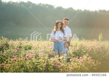 Family couple of togetherness in a field of flowers. 60501166
