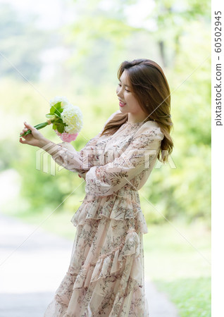 The look of a beautiful Korean woman, a park walk The look of a beautiful Korean woman, a park walk 60502945