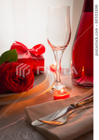 Festive or romantic dinner with red rose and champagne. Valentine day. Festive or romantic dinner with red rose and champagne. Valentine day. 60503896