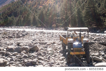 Autonomous dumper Truck Construction vehicle parked on industrial site on bank of Beas River Autonomous dumper Truck Construction vehicle parked on industrial site on bank of Beas River 60503968