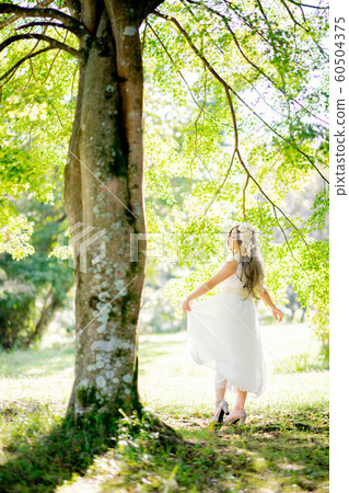 A woman in the forest A woman in the forest 60504375