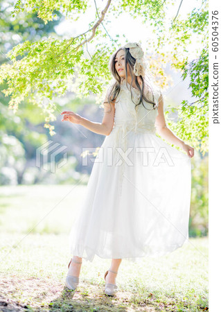 A woman in the forest A woman in the forest 60504376