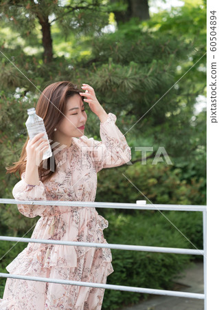 The look of a beautiful Korean woman, a park walk The look of a beautiful Korean woman, a park walk 60504894