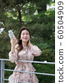 The look of a beautiful Korean woman, a park walk 60504909