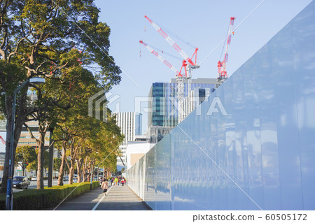 Yokohama Minato Mirai Boulevard sidewalk with white temporary fence 60505172