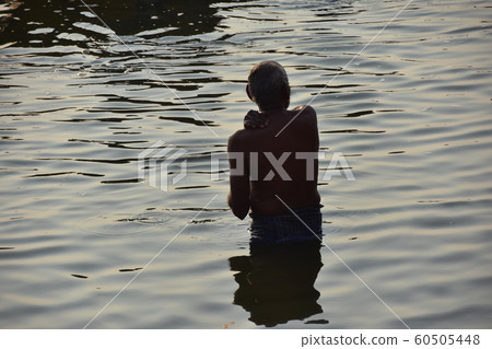 Indian World Warrenashi Indian Hindu Man Taking a Bath on the Ganges River 60505448