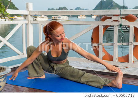 Young woman practicing yoga 60505712
