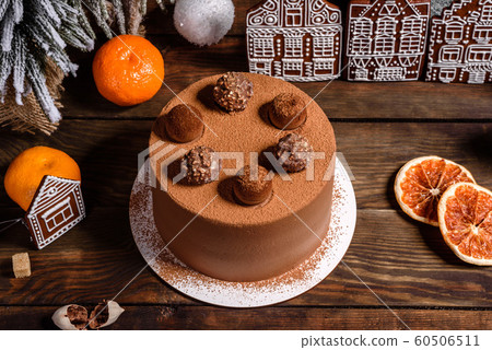 Christmas holiday table with delicious truffle cake Christmas holiday table with delicious truffle cake 60506511