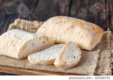 Ciabatta on wooden board Ciabatta on wooden board 60508742