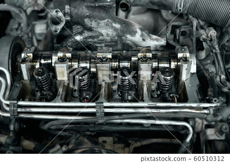 Dismantled car engine under bonnet with dirty details Dismantled car engine under bonnet with dirty details 60510312