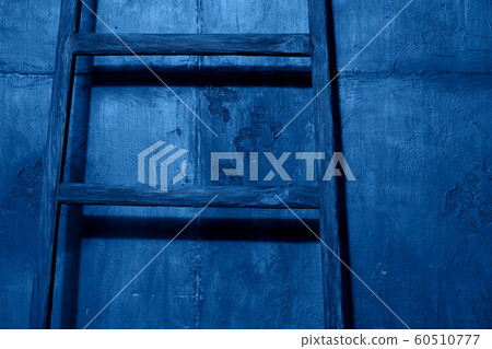 Wooden staircase on wall background in blue color Wooden staircase on wall background in blue color 60510777