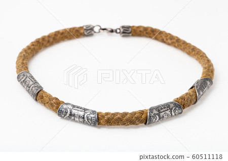 cotton rope with ancient silver coins on white cotton rope with ancient silver coins on white 60511118