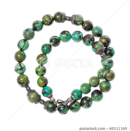 coiled necklace from polished turquoise isolated 60511160