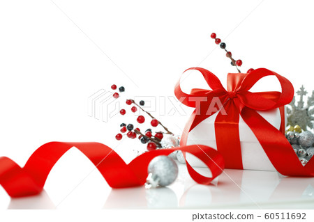 Christmas gift with red balls bow and branch 60511692