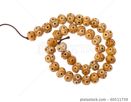 spiral string of carved bone beads isolated spiral string of carved bone beads isolated 60511739