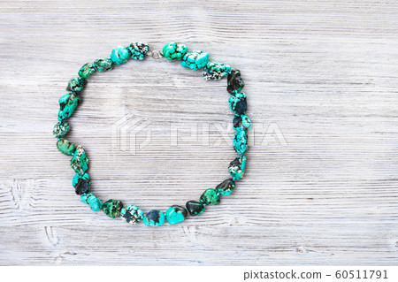 top view of colored howlite necklace on gray 60511791