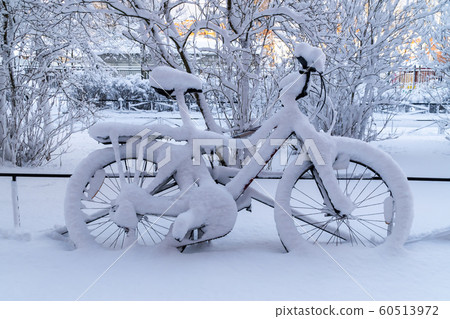 After a very heavy snowfall in the courtyard of Kronstadt remained snow-covered bike. 60513972