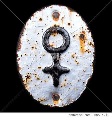 Symbol female made of forged metal on the background fragment of a metal surface with cracked rust. 60515210
