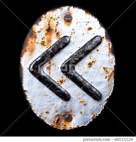 Symbol left pointing double angle quotation mark made of forged metal on the background fragment of a metal surface with cracked rust. Symbol left pointing double angle quotation mark made of forged metal on the background fragment of a metal surface with cracked rust. 60515229