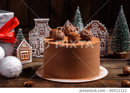 Christmas holiday table with delicious truffle cake Christmas holiday table with delicious truffle cake 60522122