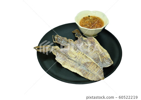 crushed grilled squid tradition Thai snack on plate dipping with sweet sauce crushed grilled squid tradition Thai snack on plate dipping with sweet sauce 60522219