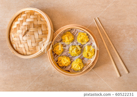 Traditional dumplings Manti steamed in wooden pot. Traditional dumplings Manti steamed in wooden pot. 60522231
