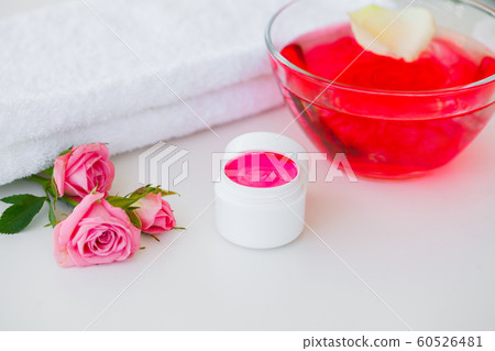 Wellness Products and Cosmetics. Herbal and mineral skincare. Jar of cream, white cosmetic bottles. Without label. Spa Set with soap and white towel 60526481