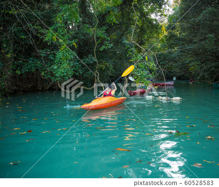 Children enjoying a canoe Children enjoying a canoe 60528583