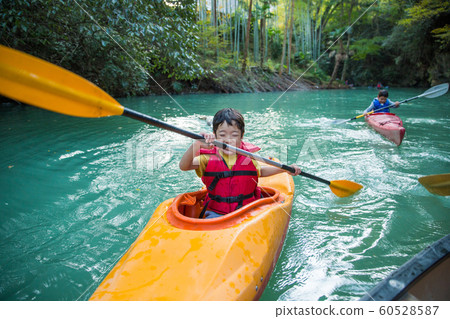 Children enjoying a canoe Children enjoying a canoe 60528587