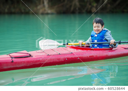 Children enjoying a canoe Children enjoying a canoe 60528644