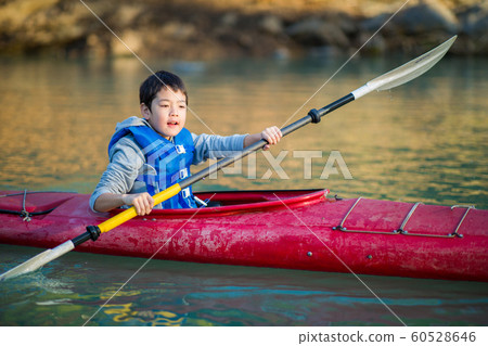 Children enjoying a canoe 60528646