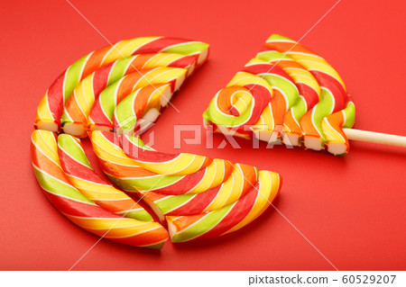 A large multi-colored Lollipop split into pieces, 60529207