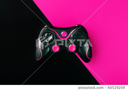 Black gamepad on black and pink background. Game Black gamepad on black and pink background. Game 60529209