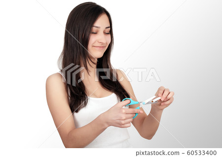 Healthy Young Woman Refusing To Take Cigarette From Pack. Portrait Of Beautiful Female Showing Stop Sign With Hand To Cigarettes. Quit Smoking Concept. High Resolution Healthy Young Woman Refusing To Take Cigarette From Pack. Portrait Of Beautiful Female Showing Stop Sign With Hand To Cigarettes. Quit Smoking Concept. High Resolution 60533400