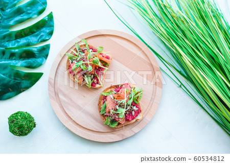 Tasty italian bruschetta on the wooden plate 60534812