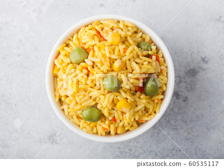 White bowl with boiled organic basmati vegetable White bowl with boiled organic basmati vegetable 60535117