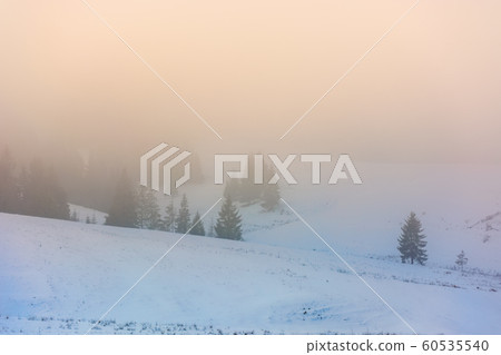 mountainous countryside in fogmountainous 60535540