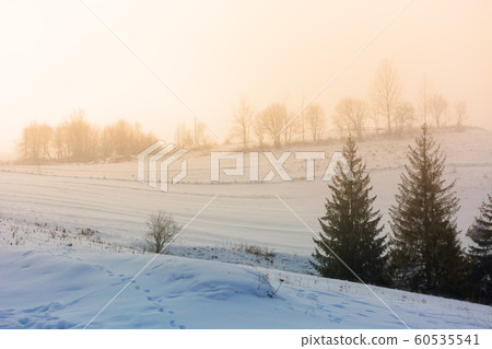 mountainous countryside in fogmountainous 60535541