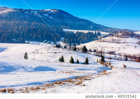 mountainous countryside in wintertime 60535542