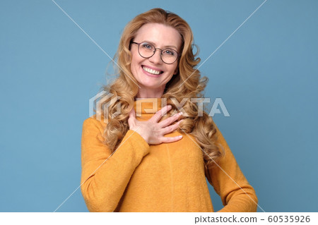 Mature woman with blonde curly hair being touched with b compliment Mature woman with blonde curly hair being touched with b compliment 60535926