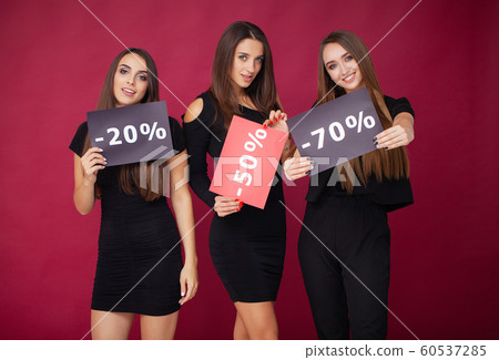 Shopping. Elegant brunette women wears black dress holding shopping bags, black friday concept Shopping. Elegant brunette women wears black dress holding shopping bags, black friday concept 60537285
