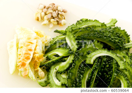 Sliced bitter gourd with cotton and seeds Sliced bitter gourd with cotton and seeds 60539064