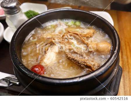 Korean food, Samgyetang (ginseng chicken soup) served in a hot bowl Korean food, Samgyetang (ginseng chicken soup) served in a hot bowl 60542516