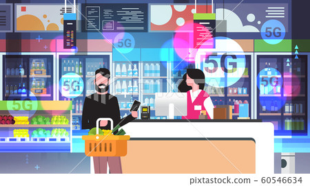 man paying with smartphone at checkout counter customer using nfc paying system 5G online wireless connection concept modern grocery shop interior portrait horizontal 60546634