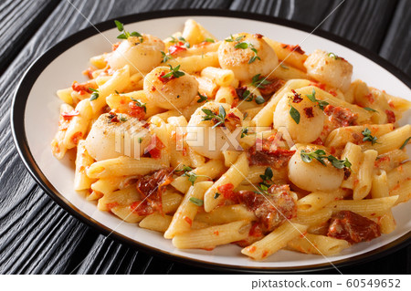 Italian food pasta with fried scallops, dried Italian food pasta with fried scallops, dried 60549652