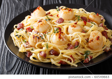 Mediterranean pasta with fried scallops, bacon in Mediterranean pasta with fried scallops, bacon in 60549663
