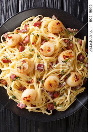Italian spaghetti with scallops and bacon in a Italian spaghetti with scallops and bacon in a 60549666