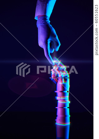 Touching fingers of engineer and digital technology that he creates. Acquaintance of man and technology. Touching fingers of engineer and digital technology that he creates. Acquaintance of man and technology. 60551623