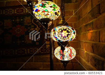 Vintage wall lamp with eastern ornates on it. 60553421