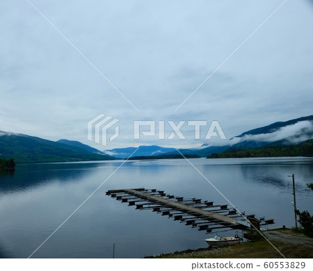 A fjord view and Jetty with a blue sky at Slidrefjord A fjord view and Jetty with a blue sky at Slidrefjord 60553829